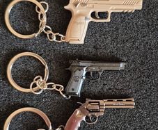 Keyring, firearms, baretta, luger, mauser,sig sauer, colt.