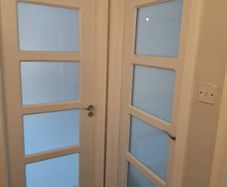 white internal solid wood laminate covered doors x 3