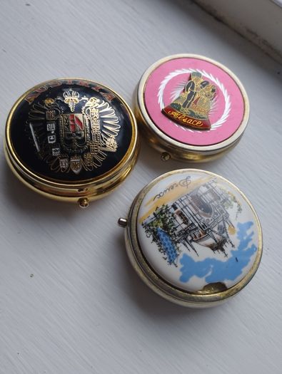 Three vintage pill boxes.