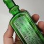 396 - Antique Aceite De Bellotas y Savia De Coco Green Glass Bottle Image 4
