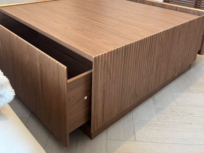 Square wooden coffee table with fluted detailing
