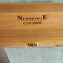 A Newbridge Cuisine set of six steak knives with serrated blades and wooden handles. Image 2