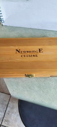 A Newbridge Cuisine set of six steak knives with serrated blades and wooden handles.