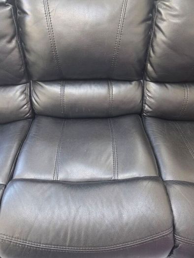 Black leather recliner sofa