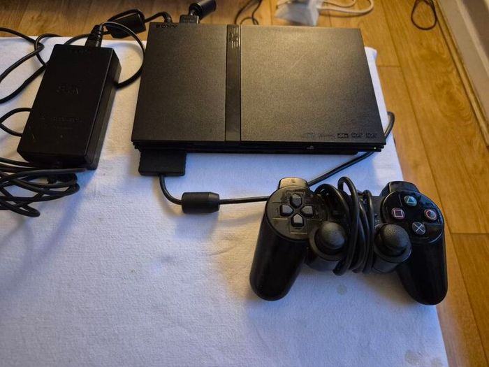Play Station 2 super slim + DualShock 2 + Charlie game
