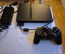 Play Station 2 super slim + DualShock 2 + Charlie game