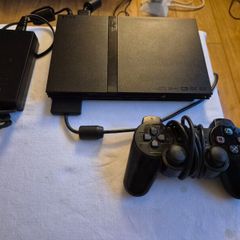 Play Station 2 super slim + DualShock 2 + Charlie game