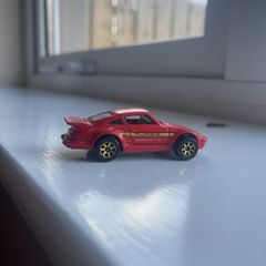 1989 orange Porsche Turbo 930, Hot Wheels metal base,