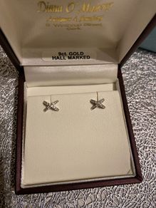 white gold pair of earrings brand new in box