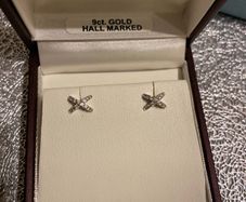 white gold pair of earrings brand new in box