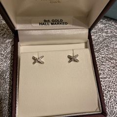white gold pair of earrings brand new in box