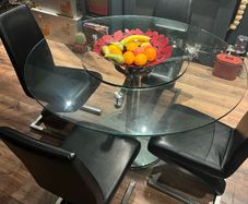 Glass dining table with rotator and 4 leather chairs