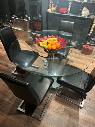 Glass dining table with rotator and 4 leather chairs