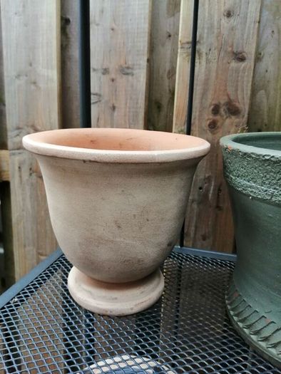 Urn shaped terracotta plant pot