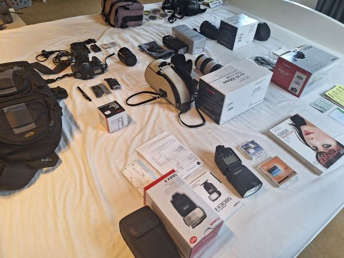 canon camera and pro lenses and a Pentax film system