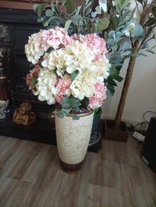 flowers in tall vase