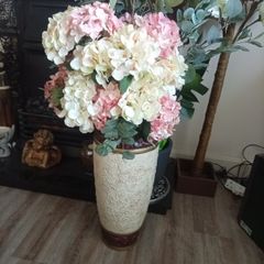 flowers in tall vase