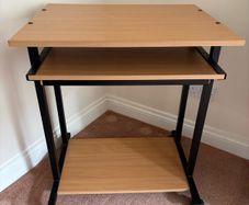 Computer desk with sliding shelf on wheels