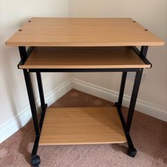 Computer desk with sliding shelf on wheels