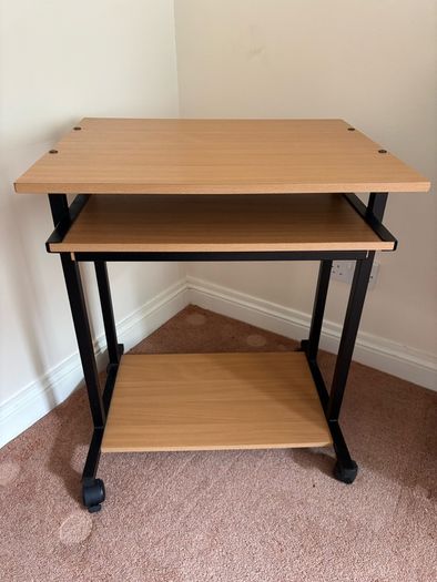 Computer desk with sliding shelf on wheels
