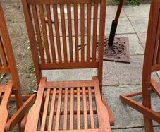 Four foldable garden chairs, one table and a parasol