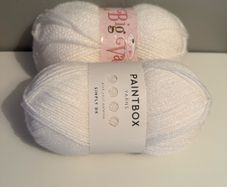2 balls of white yarn wool