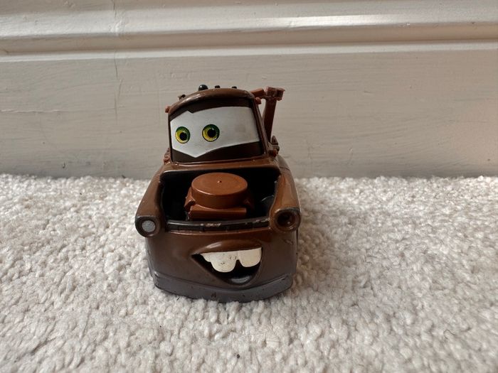 Disney Pixar Cars Radiator Springs Tow Mater Truck Diecast Metal Vehicle approx. 9.5 cm. length one of the back wheels is not working usad Please see photos