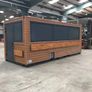 A 6-meter (20-foot) shipping container housing a cafe, with a very minimalist design Image 2