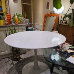 Classic mid-century / Space Age white tulip dining table with a heavy metal pedestal base