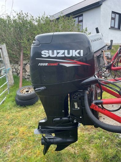 Suzuki 90 HP 4 stroke long shaft.
