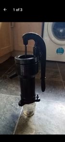 old antique cast iron water pump