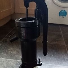 old antique cast iron water pump