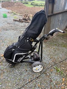 Powacaddy electric trolley with titleist golf bag