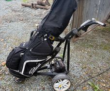 Powacaddy electric trolley with titleist golf bag