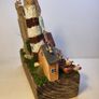 Wooden lighthouse coastal scene! Image 6