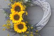 55cm white wicker heart wreath with sunflowers
