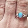 Ring made of 925 silver with oval opal of blue shade and cubic zirconia. Image 8
