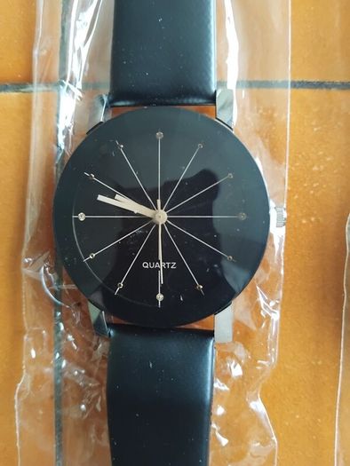 2 mens watches with leather straps.