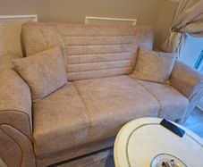 3 seater and matching 2 seater storage compartment underneath and can also be used as pull out bed