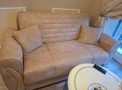 3 seater and matching 2 seater storage compartment underneath and can also be used as pull out bed