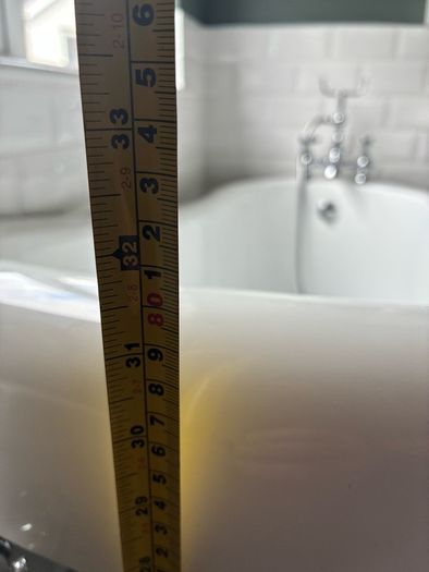 free standing bath with taps and and hose