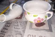 His and Hers Old Ceramic Chamber Pots hand painted floral chamber pot with side handle, together with a white glazed shaped bottle featuring scroll handle and narrow spout