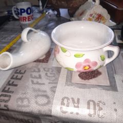 His and Hers Old Ceramic Chamber Pots hand painted floral chamber pot with side handle, together with a white glazed shaped bottle featuring scroll handle and narrow spout