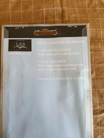 LBB metal J-shaped curtain holdbacks in a brushed chrome finish