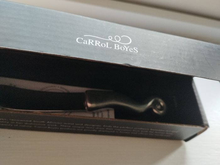 A collectible knife made of polished pewter with a stainless steel blade from Carrol Boyes.