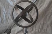 Metal globe and arrow.