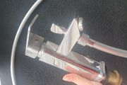 Bath tap with a shower head