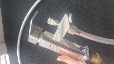 Bath tap with a shower head