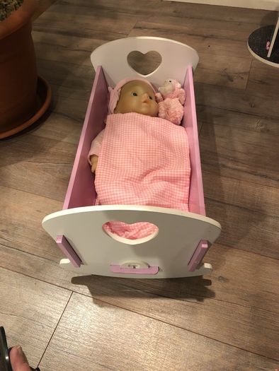 Doll crib with a baby