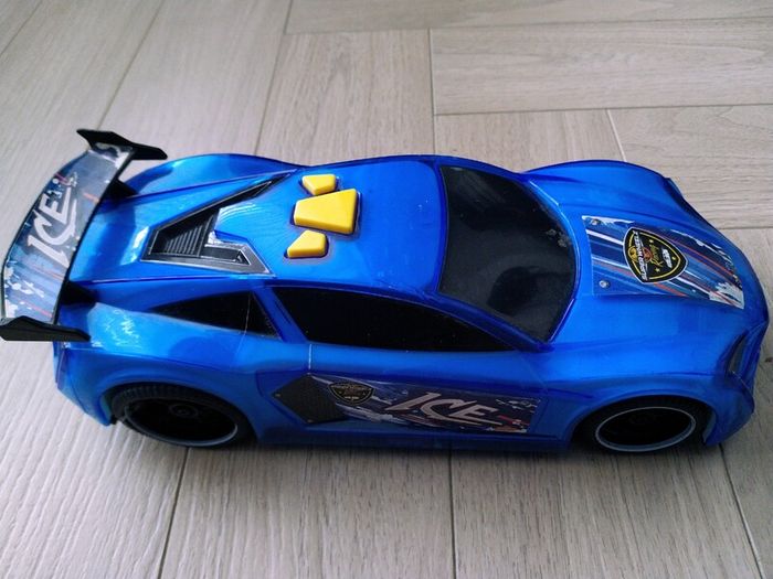 3 remote control vehicles & 1 blue racecar with lights & sounds